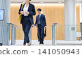 Business person passing through the entrance gate 141050943