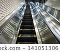 Long subway escalator 141051306