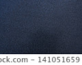 Smooth black surface with fine texture providing an abstract backdrop for various designs 141051659