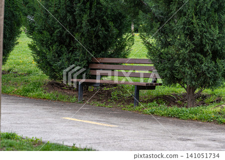 Garden bench in the spring park Garden bench in the spring park 141051734