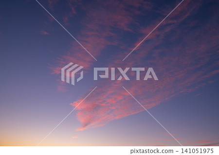 Beautiful, tranquil sunset paints utah sky with vibrant colorful clouds. natural outdoor atmosphere glows with peaceful serenity at dusk, evoking sense of wonder Beautiful, tranquil sunset paints utah sky with vibrant colorful clouds. natural outdoor atmosphere glows with peaceful serenity at dusk, evoking sense of wonder 141051975