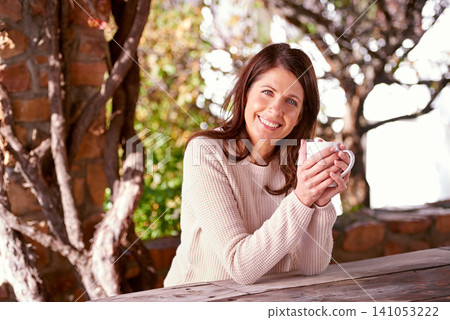 Morning, portrait and woman drinking coffee, espresso or cappuccino in backyard garden of home. Bokeh, smile and face of female person with hot beverage for relax, peace and happiness in nature Morning, portrait and woman drinking coffee, espresso or cappuccino in backyard garden of home. Bokeh, smile and face of female person with hot beverage for relax, peace and happiness in nature 141053222