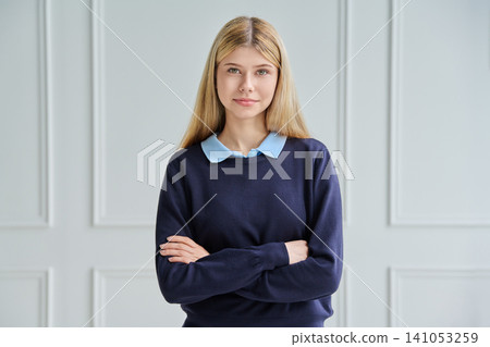 Confident smiling teenage student girl arms crossed Confident smiling teenage student girl arms crossed 141053259