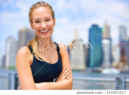 Workout, portrait and woman with arms crossed for fitness, morning exercise or running competition in city. Smile, wellness and face of female person for cardio, energy and confidence in New York 141053311