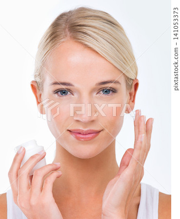 Woman, portrait and moisturiser product for skincare healthy or dermatology wellness, cream or white background. Female person, face and hand with lotion in studio for self care, sunscreen or mockup Woman, portrait and moisturiser product for skincare healthy or dermatology wellness, cream or white background. Female person, face and hand with lotion in studio for self care, sunscreen or mockup 141053373