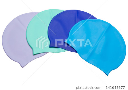 Four colorful silicone swimming caps arranged in an arc isolated on white background, set of bright waterproof swim hats Four colorful silicone swimming caps arranged in an arc isolated on white background, set of bright waterproof swim hats 141053677
