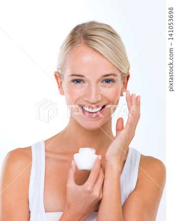 Woman, portrait and skincare cream in studio or moisturizer wellness with dermatology, product or white background. Female person, lotion and facial sunscreen or self care protection, smile or mockup Woman, portrait and skincare cream in studio or moisturizer wellness with dermatology, product or white background. Female person, lotion and facial sunscreen or self care protection, smile or mockup 141053698