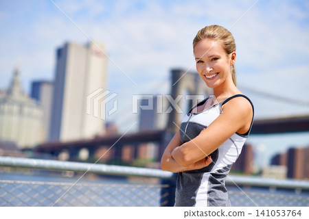 Woman, portrait and confident in city for fitness morning routine, wellness and exercise for active cardio. Female person, happy and runner or athlete for sports hobby or training workout in New York Woman, portrait and confident in city for fitness morning routine, wellness and exercise for active cardio. Female person, happy and runner or athlete for sports hobby or training workout in New York 141053764
