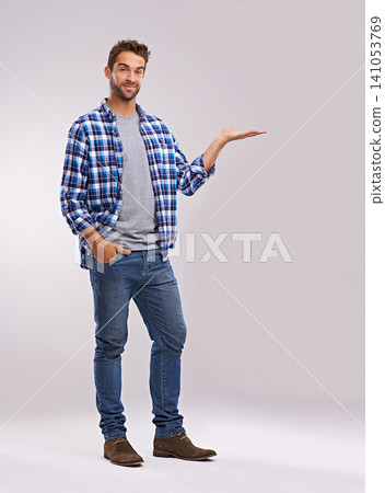 Portrait, presentation and casual man in studio with smile, deal announcement and product placement. Showing, advice and creative person pointing at offer, notification and white background mockup Portrait, presentation and casual man in studio with smile, deal announcement and product placement. Showing, advice and creative person pointing at offer, notification and white background mockup 141053769