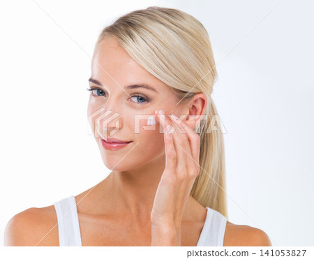 Woman, portrait and skincare lotion in studio or moisturizer wellness with dermatology, product or white background. Female person, cream and facial sunscreen or self care, protection or mockup space Woman, portrait and skincare lotion in studio or moisturizer wellness with dermatology, product or white background. Female person, cream and facial sunscreen or self care, protection or mockup space 141053827