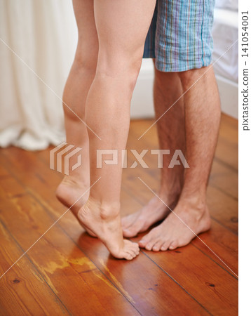 Feet, floor and couple kiss for love, care and bonding together with partner in apartment. Legs, romance and people tiptoe foot for connection, healthy relationship or commitment to marriage in home Feet, floor and couple kiss for love, care and bonding together with partner in apartment. Legs, romance and people tiptoe foot for connection, healthy relationship or commitment to marriage in home 141054001
