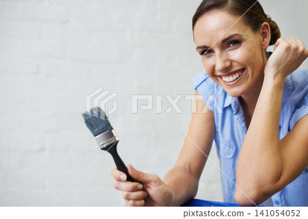 Woman, portrait and brush for paint in home, remodeling and fixing in apartment. Happy female person, smile and equipment for project upgrade, do it yourself and tool for house repairs or project Woman, portrait and brush for paint in home, remodeling and fixing in apartment. Happy female person, smile and equipment for project upgrade, do it yourself and tool for house repairs or project 141054052