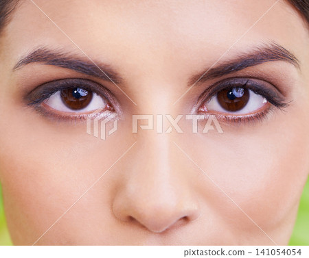 Woman, portrait and eye vision with makeup, cosmetics and skincare with plant and green background. Wellness, care and facial treatment with female person and eyecare with dermatology and skin glow Woman, portrait and eye vision with makeup, cosmetics and skincare with plant and green background. Wellness, care and facial treatment with female person and eyecare with dermatology and skin glow 141054054