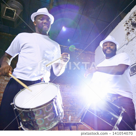 Band, carnival and music for performance, entertainment and musician in group. Concert, show and portrait celebration for musical artist, smile and drum for male Brazilian talent with lens flare Band, carnival and music for performance, entertainment and musician in group. Concert, show and portrait celebration for musical artist, smile and drum for male Brazilian talent with lens flare 141054070