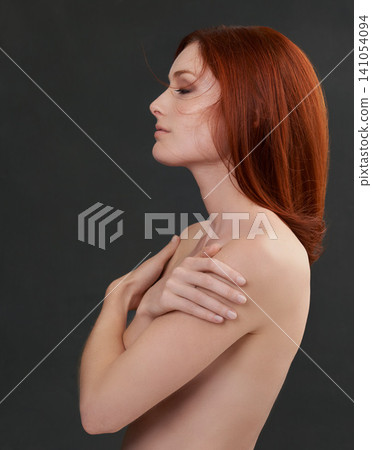 Red hair, body and naked woman in studio for beauty, wellness or color, shampoo or results on black background. Haircare, self love or ginger nude model with growth, pride or glowing skin cosmetics Red hair, body and naked woman in studio for beauty, wellness or color, shampoo or results on black background. Haircare, self love or ginger nude model with growth, pride or glowing skin cosmetics 141054094