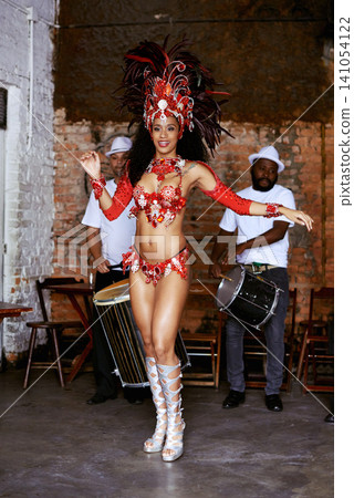 Women, samba dancer and happy at carnival, stage and band with fashion, culture and creativity in nightclub. Girl, people and dancing with music, drums and tradition for celebration in Rio de Janeiro Women, samba dancer and happy at carnival, stage and band with fashion, culture and creativity in nightclub. Girl, people and dancing with music, drums and tradition for celebration in Rio de Janeiro 141054122