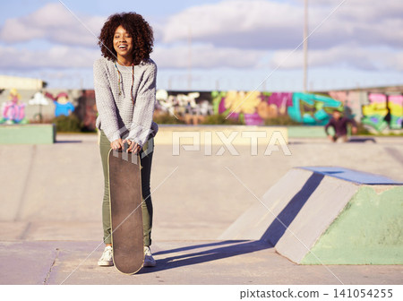 Skatepark, fashion and black woman with skateboard in city for exercise, training and skating. Skater, smile and happy female person for trendy, edgy style and hipster clothing in urban town Skatepark, fashion and black woman with skateboard in city for exercise, training and skating. Skater, smile and happy female person for trendy, edgy style and hipster clothing in urban town 141054255