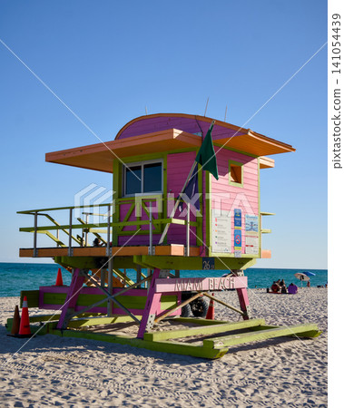 Pink Lifeguard Hut Against Clear Blue Sky and Ocean Pink Lifeguard Hut Against Clear Blue Sky and Ocean 141054439