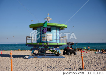 Colorful Lifeguard Tower With Beach Patrol Vehicle Nearby Colorful Lifeguard Tower With Beach Patrol Vehicle Nearby 141054446