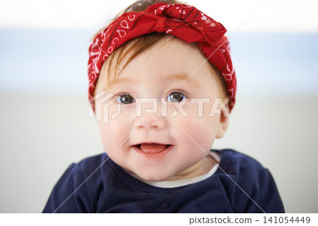 Portrait, happy and cheerful baby fashion in family home, cute and trendy street style on curious girl toddler. Creative, child development and growth, adorable headband accessory on smile kid Portrait, happy and cheerful baby fashion in family home, cute and trendy street style on curious girl toddler. Creative, child development and growth, adorable headband accessory on smile kid 141054449