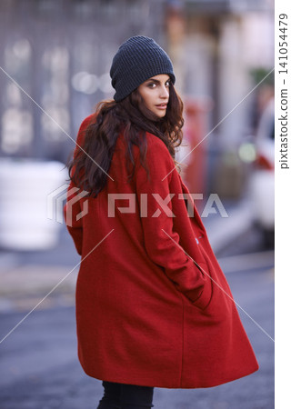 Winter, fashion and portrait of woman in city with jacket for travel in cool style or red coat. Streetwear, clothes and girl walking with confidence and pride outdoor in New York morning commute Winter, fashion and portrait of woman in city with jacket for travel in cool style or red coat. Streetwear, clothes and girl walking with confidence and pride outdoor in New York morning commute 141054479