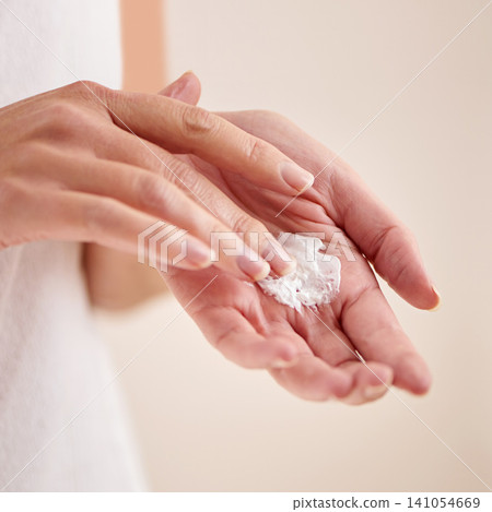 Woman, hands or cream product for beauty, skincare or cosmetics application for moisturiser or anti aging. Fingers, closeup or person with smooth skin, shine or cream for glow or dermatology in home Woman, hands or cream product for beauty, skincare or cosmetics application for moisturiser or anti aging. Fingers, closeup or person with smooth skin, shine or cream for glow or dermatology in home 141054669