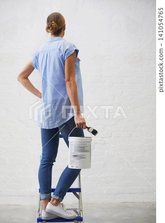 Woman, ladder and paintbrush for renovation in home, remodeling and maintenance in apartment. Female person, ladder and equipment for interior upgrade, diy and back tool for house repairs or project Woman, ladder and paintbrush for renovation in home, remodeling and maintenance in apartment. Female person, ladder and equipment for interior upgrade, diy and back tool for house repairs or project 141054765