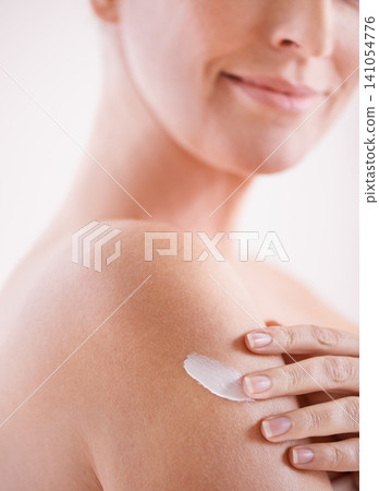 Woman, skincare and arm with cream for application, dermatology and cosmetics for wellness with smile. Female person, happy and body with product for self care, moisturizer or lotion for skin glow Woman, skincare and arm with cream for application, dermatology and cosmetics for wellness with smile. Female person, happy and body with product for self care, moisturizer or lotion for skin glow 141054776
