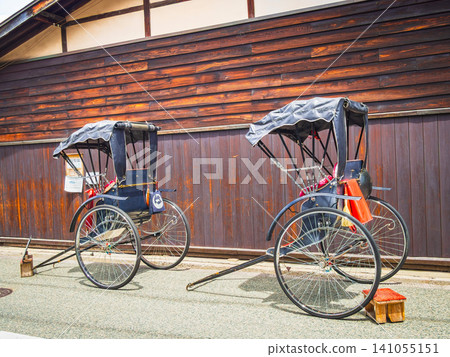 Rickshaws waiting for customers in Kami-Sannomachi, Hida Takayama. Rickshaws waiting for customers in Kami-Sannomachi, Hida Takayama. 141055151