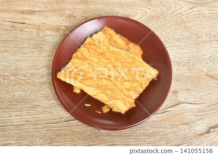 dry salty pounded beef meat Thai snack protein arranging on plate dry salty pounded beef meat Thai snack protein arranging on plate 141055156