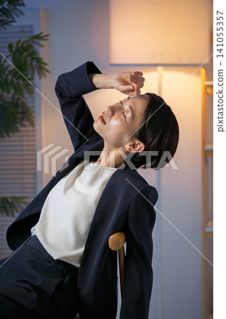Tired business woman Tired business woman 141055357