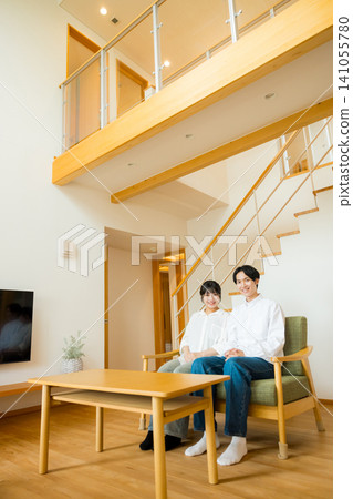 A couple talking in the living room A couple talking in the living room 141055780