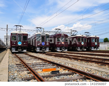 Hankyu 7000 series train on display under a blue sky. 141056007