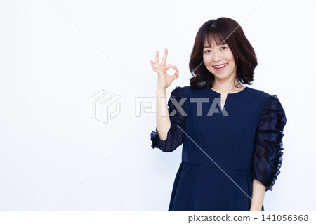 Woman signing OK Woman signing OK 141056368