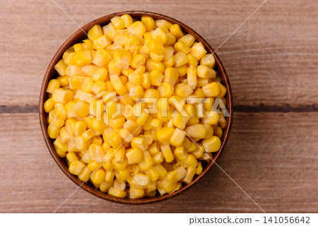 Golden, sweet canned corn kernels or maize for salads and vegetarian dishes. Canned corn Golden, sweet canned corn kernels or maize for salads and vegetarian dishes. Canned corn 141056642