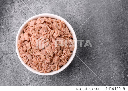 Fish, canned tuna chunks in brine for sandwiches and salads. Canned tuna Fish, canned tuna chunks in brine for sandwiches and salads. Canned tuna 141056649
