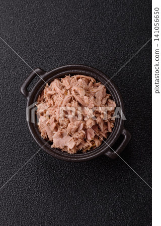 Fish, canned tuna chunks in brine for sandwiches and salads. Canned tuna Fish, canned tuna chunks in brine for sandwiches and salads. Canned tuna 141056650