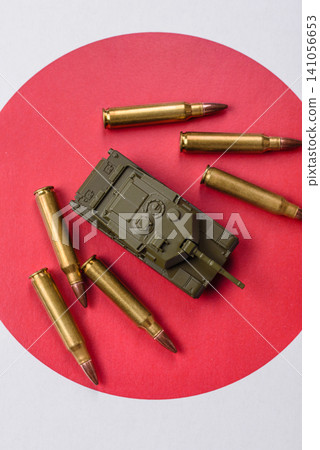 A tank on the Japanese flag as a conceptual backdrop representing defense A tank on the Japanese flag as a conceptual backdrop representing defense 141056653