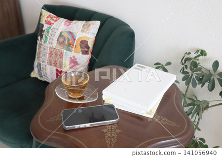 Reading and tea time on my favorite sofa Reading and tea time on my favorite sofa 141056940