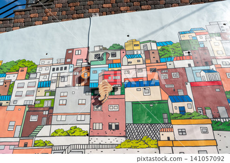 Gamcheon Culture Village, Busan, South Korea - Nov. 09, 2024: Artistic mural wall paintings. Gamcheon Culture Village, Busan, South Korea - Nov. 09, 2024: Artistic mural wall paintings. 141057092