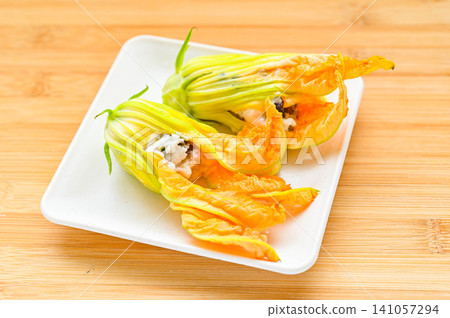 A home-style dish of stuffed zucchini flowers. 141057294