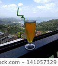A breathtaking view of the beautiful sea and mountains unfolding under a clear blue sky from a restaurant in Jiufen, Taiwan. 141057329