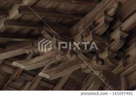 A historical and traditional wooden architectural joinery, intricately assembled without the use of any nails. A historical and traditional wooden architectural joinery, intricately assembled without the use of any nails. 141057491