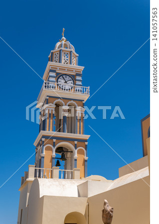 Ornate clock tower of Saint John the Baptist Cathedral in Fira Santorini 141057563