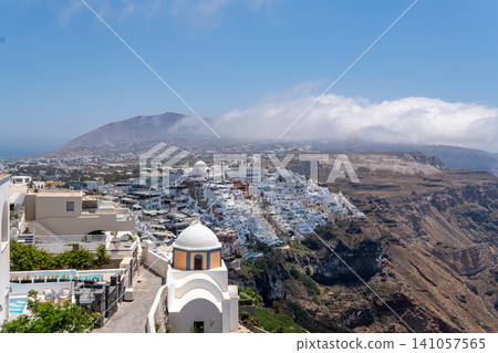 Panoramic view of Fira town and caldera cliffs in Santorini Greece Panoramic view of Fira town and caldera cliffs in Santorini Greece 141057565