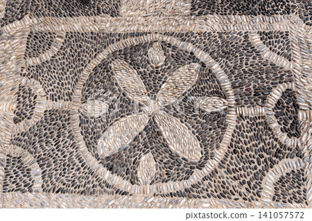 Traditional greek pebble mosaic floor with floral ornament pattern Traditional greek pebble mosaic floor with floral ornament pattern 141057572