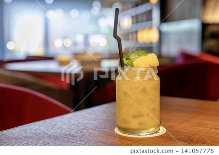 A refreshing mango pineapple drink with mango. A refreshing mango pineapple drink with mango. 141057778