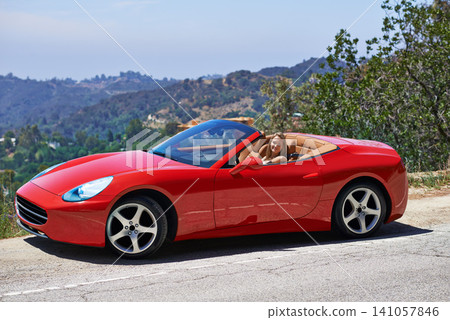 Woman, red sportscar and road trip on mountain, travel and luxury transport on summer drive. Female person, holiday and countryside wellness on street, vacation and adventure in convertible vehicle Woman, red sportscar and road trip on mountain, travel and luxury transport on summer drive. Female person, holiday and countryside wellness on street, vacation and adventure in convertible vehicle 141057846
