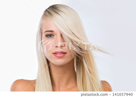 Blonde woman, long hair and studio portrait with smile, wellness or results for beauty by white background. Girl, person and model for hairstyle, transformation or change with natural glow for health Blonde woman, long hair and studio portrait with smile, wellness or results for beauty by white background. Girl, person and model for hairstyle, transformation or change with natural glow for health 141057940