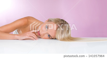 Studio, portrait and beauty of woman with skincare for health, glow and shine of skin of girl. Pink background, adult and female person with soft, face and results from dermatology and cosmetics Studio, portrait and beauty of woman with skincare for health, glow and shine of skin of girl. Pink background, adult and female person with soft, face and results from dermatology and cosmetics 141057964